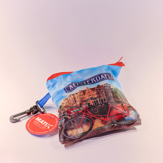 Hopvikbar kasse med avtryck av en röd cykel längs en kanal i Amsterdam från Matix Souvenir Holland