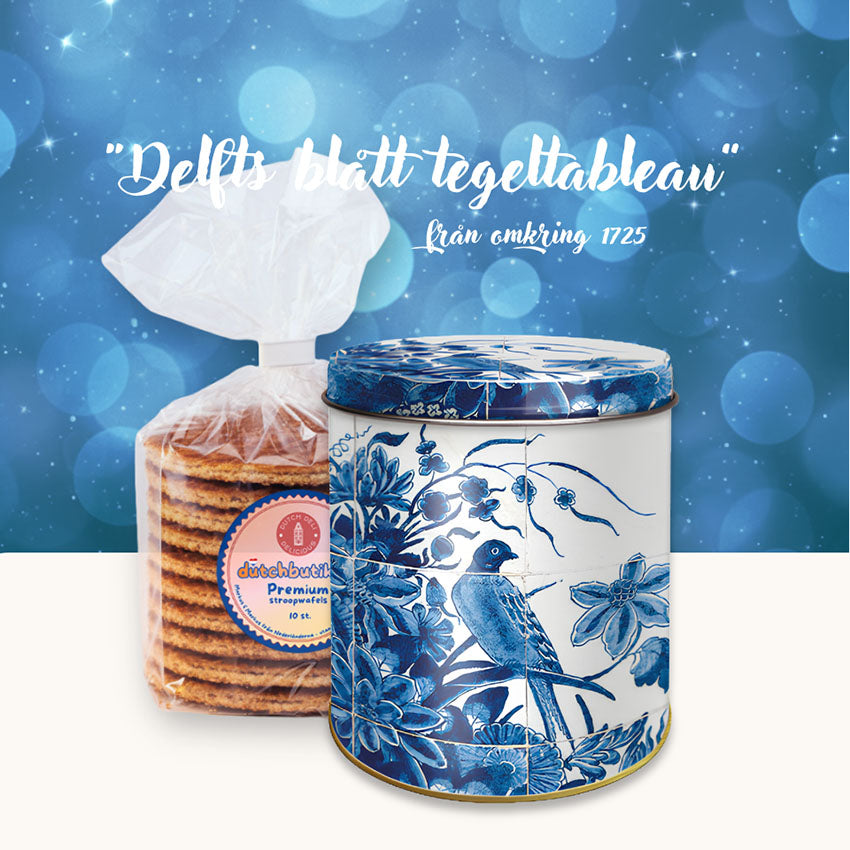 Delfts Blauw stroopwafel-/förvaringsburk med klassiskt blåvitt tegeltableau och motiv av blommor och fåglar samt ett paket premium stroopwafels från Markus & Markus.