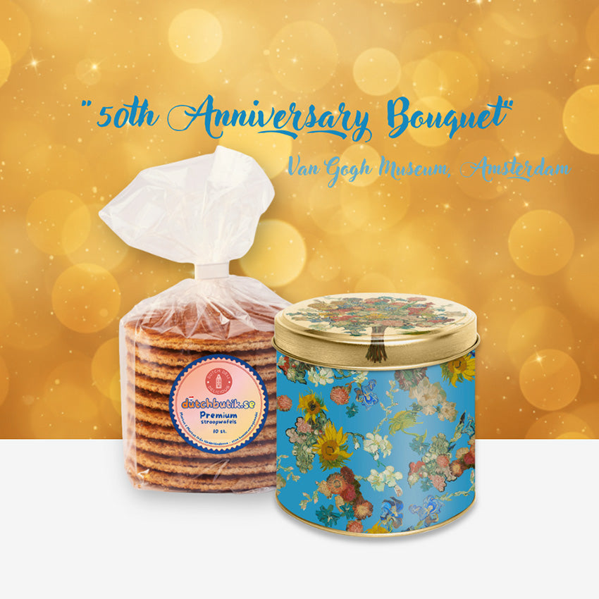 Van Gogh Vincent's Flowers stroopwafel-/förvaringsburk i guldmetallic med ljusblått blomstermotiv och ett paket premium stroopwafels från Markus & Markus.