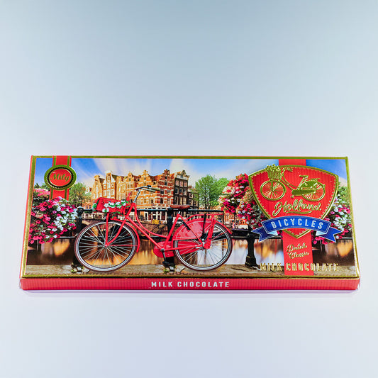 Chokladkaka LJUS förpackningen med avtryck av en röd cykel längs en kanal i Amsterdam (Chocoladereep MELK) från Matix Souvenir Holland