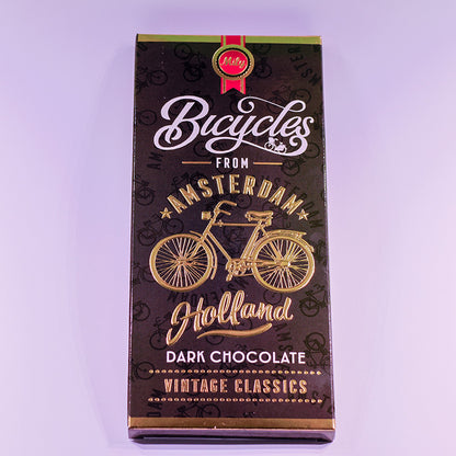 Chokladkaka MÖRKA förpackningen med guldcyckel och texten Amsterdam (chocoladereep Puur) från Matix Souvenir Holland