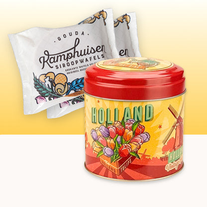 Röd och gul Tulpan & Kvarn-burk med två paket Kamphuisen sirapsvåfflor, ett exklusivt holländskt gåvoset med tulpaner, väderkvarn och klassiska nederländska delikatesser.