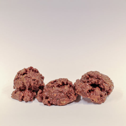 Tre bitar av  sirapsvåffla bitar med MÖRKA choklad (Stroopwafelrotsjes PUUR) från Holland. 